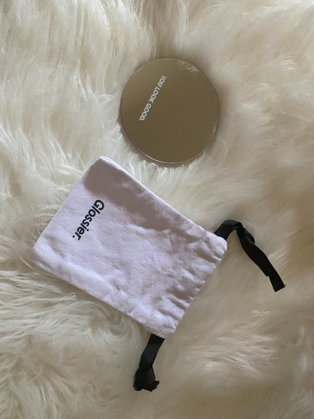 Glossier mirror with pouch